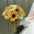 Bride in white dress holding a large sunflower and white rose bouquet with gypsophila and eucalyptus — Golden Bridal by Blossom Surprise Northampton