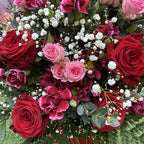 Macro detail of red rose, cerise carnation, pink spray rose and white gypsophila in a box bouquet arrangement -- Blossom Surprise Northampton