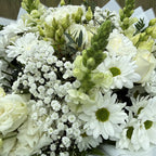 Close-up detail of white garden bouquet showing lisianthus buds, green snapdragon spikes, gypsophila and chrysanthemums -- Blossom Surprise Northampton