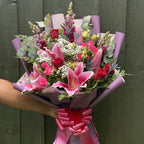 Stargazer lily bouquet hand-tied with roses, snapdragons and thistle, finished with hot pink satin ribbon -- Blossom Surprise Northampton