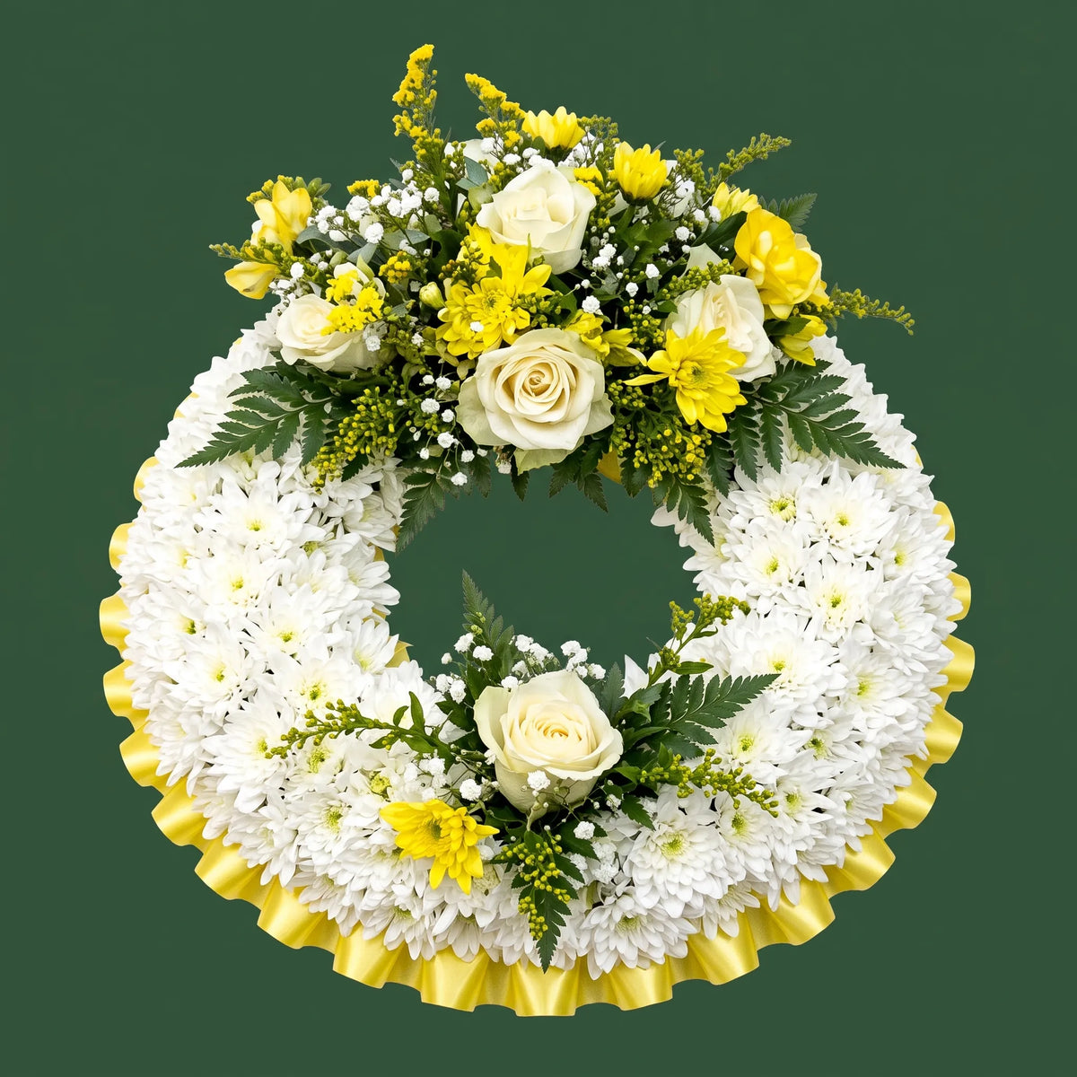A circular floral wreath featuring white chrysanthemums, yellow roses, white baby's breath, and green foliage, with a pleated yellow base, set against a solid dark green background.